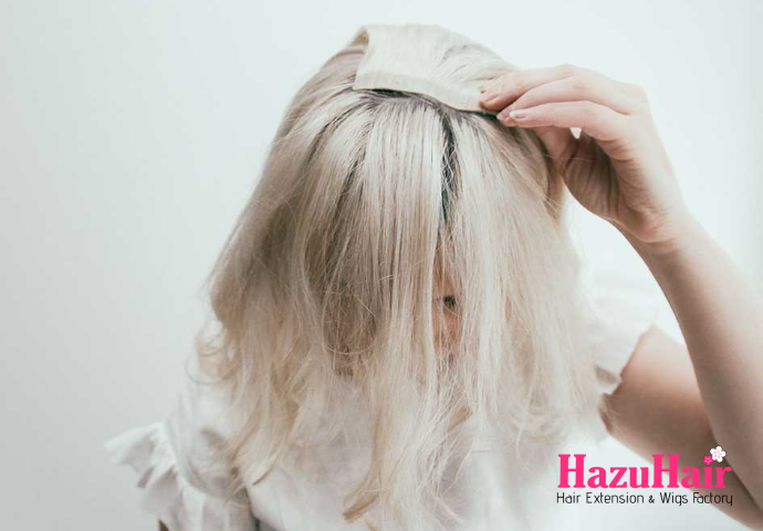 Separate some hair about halfway at the front of your head and clip in a 2 clip weft facing downward